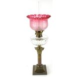 A late Victorian oil lamp, with W & B clear glass funnel, cranberry and etched glass shade, cut