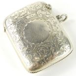 An Edwardian silver Vesta case, of shaped form with vacant cartouche, partially engine turned with