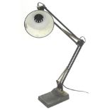 A vintage Anglepoise lamp, in black on metal adjustable stand and shaped base, the base 19cm wide.