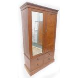 A late Victorian oak and burr elm double wardrobe, with a moulded cornice above a mirrored door,