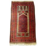 A Persian design prayer rug, decorated with medallions and multiple borders and a Mihrab, 132cm x
