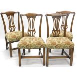 A set of four Reprodux oak Chippendale design dining chairs, each with shaped cresting rails,