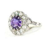 A floral cluster dress ring, set with amethyst and diamonds, florally claw set with a central