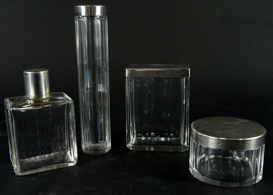 A four piece dressing table jar set, comprising needle jar, 17cm high, perfume bottle, powder box