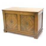 An oak blanket box, of rectangular form with double panel front on square stiles, 61cm high, 96cm