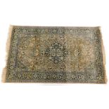 A Jacinda style rug, of rectangular form, centred with a floral medallion with an outer floral