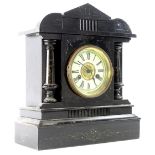 A German ebonised mantel clock, labelled for Junghans, with cross arrows, etc., 37cm H.