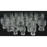 Various 20thC crystal drinking glasses, each with a hob nail cut banding, on shaped feet,