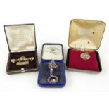 Various jewellery, a drop brooch set with small painted figure, with plain pin back, 6cm wide, an
