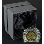 A Waterford crystal quartz mantel clock, in shaped case and outer box, label beneath, 8cm high.