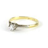 An 18ct diamond solitaire ring, the claw set stone on part pierced shank, marked 18ct Plat, size L-