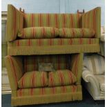 Two vintage lounge settees, with extended backs, deep seats and cushions, 145cm wide. The upholstery