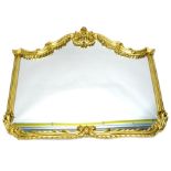 A gilt cartouche shaped wall mirror, the frame decorated with scrolls, roundels, etc., 114cm high,