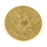 An American gold half eagle Liberty coin, 1901, 8.3g.