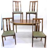 A matched vintage teak G Plan style dining room suite, comprising four chairs with serpentine