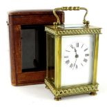 An early 20thC French carriage clock, of square form with swing handle, five part glazed case and