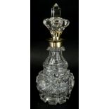 An early 20thC crystal perfume bottle, with crown stopper, white metal collar and neck and