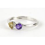 A dress ring, claw set with yellow and purple stones, marked 9K, size M, 1.4g.