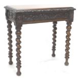A 19thC continental oak side table, of rectangular form, with a heavily carved outline and flush