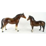 A 20thC Beswick pottery horse, in brown and white colourway, standing, printed marks beneath, 18cm