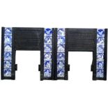 A pair of Victorian cast iron fire surrounds, each set with twelve Minton tiles, printed in blue