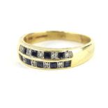A 9ct gold dress ring, set with two banks of baguette cut blue and white stones, size T, 4g.