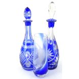 A 20thC blue and white flash glass decanter, of circular form, with a repeat hobnail cut banding,