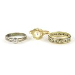Various ladies dress rings, a solitaire with paste stone, 9ct gold example set with central pearl,