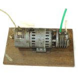 An Edwards High Vacuum Limited vacuum pump and compressor, on wooden stand, number 2388 2850 rpm,