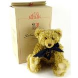 A Steiff 100 year anniversary blonde teddy bear, with blue bow and growl action, 44cm (boxed, with