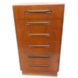 A vintage 1970's G-Plan teak narrow chest, of six long drawers, with moulded handles on a