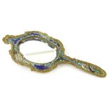 A Russian enamel hand mirror, of shaped form with gilt highlights and shaped bevel glass,
