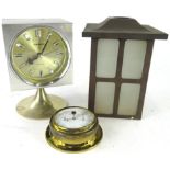 A Coramatic four jewel retro mantel clock, in square case, on inverted stem and circular foot,