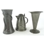 An early 20thC English pewter Art Nouveau jug, with strapwork handle, tapering body and compressed