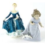 A Royal Doulton figure Janine, HN2461, printed marks beneath, 19cm high, and a Nao figure of a