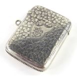A Victorian silver Vesta case, of rounded form, partially engine turned with initial cartouche and