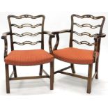 A pair of George III style mahogany carver chairs, each with pierced serpentine horizontal splats,