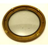 A 20thC port hole mirror, of circular form with bevelled glass and bead outline, with a moulded