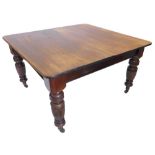 A Victorian walnut and pine extending dining table, the rectangular top with rounded corners on