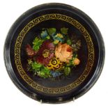 A 19thC painted papier mache plate, in the manner of Bettridge, of circular form, centred by a