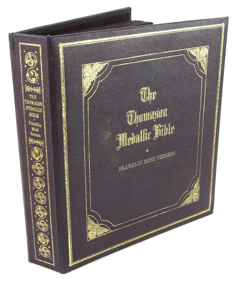 A Franklin Mint Thomason Medallic Bible, comprising 60 medallions in album with outer box.