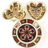 A Royal Crown Derby Old Imari pattern heart shaped dish, 10cm wide, a circular saucer and a clover