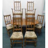 A high quality Ercol Old Colonial dining room suite, comprising extending 'D' end table on turned
