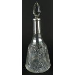 An Edwardian cut glass perfume bottle, of shouldered form, hob nail cut with a repeat geometric