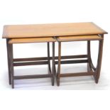 A late 1960's G-Plan teak table unit, of rectangular form, with two removable stools, each with