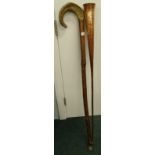 A large walking stick, with rams horn end, and a copper coaching horn with brass banding.