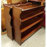A pair of mahogany finish bookcases, each with fixed shelves and a moulded gallery top, 96cm high,