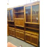 An oak display cabinet, in three sections, 186cm high, 185cm wide, 90cm deep.