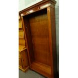 A yew wood freestanding open bookcase with dentil top, on bracket feet, 184cm high, 92cm wide, 184cm