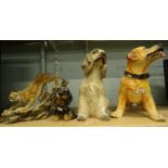 A resin figure of a golden retriever, in standing pose, another of a spaniel, a Dazzlers tiger on